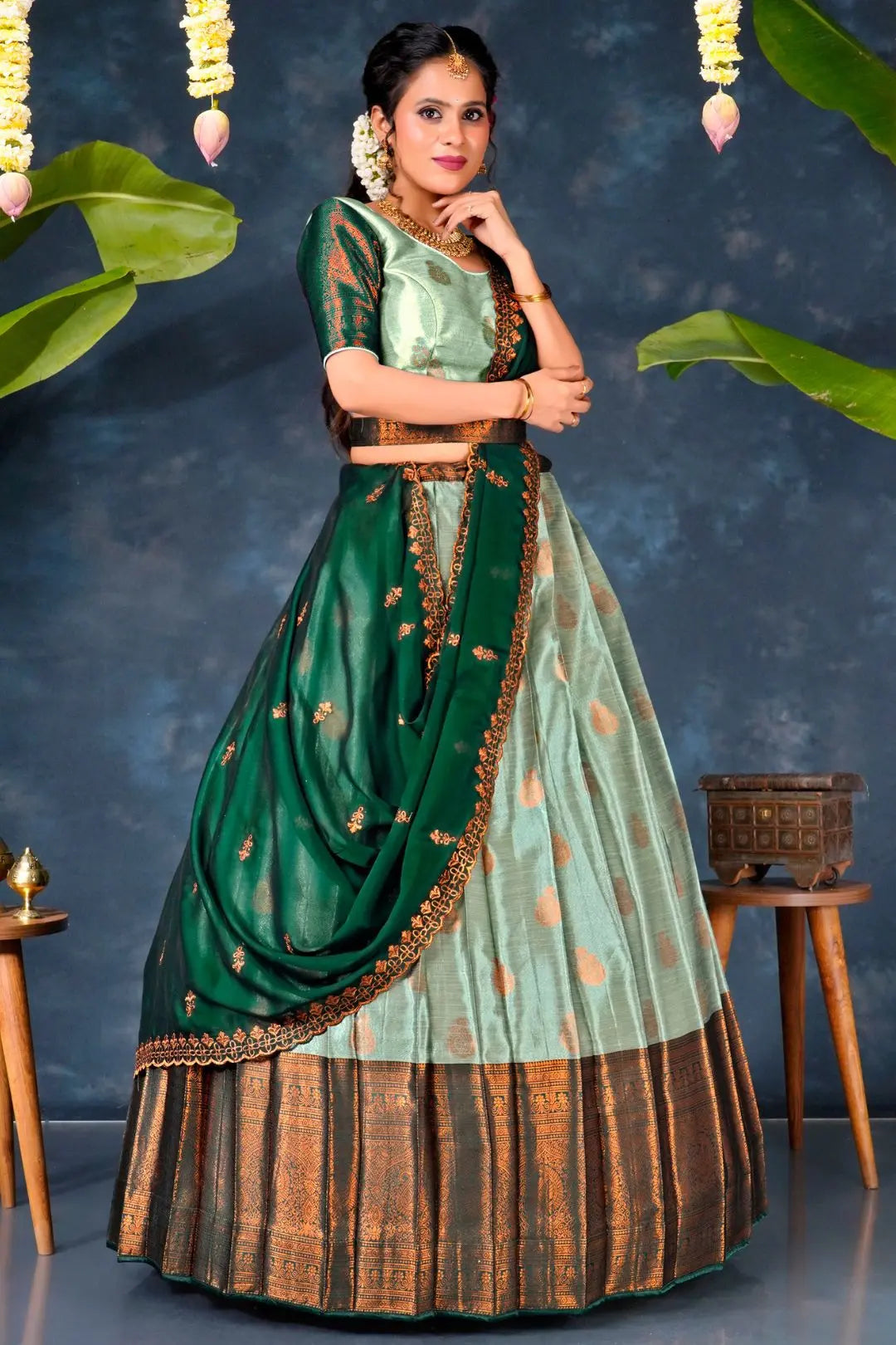 Woman in a traditional green and brown pista lehenga choli with dupatta