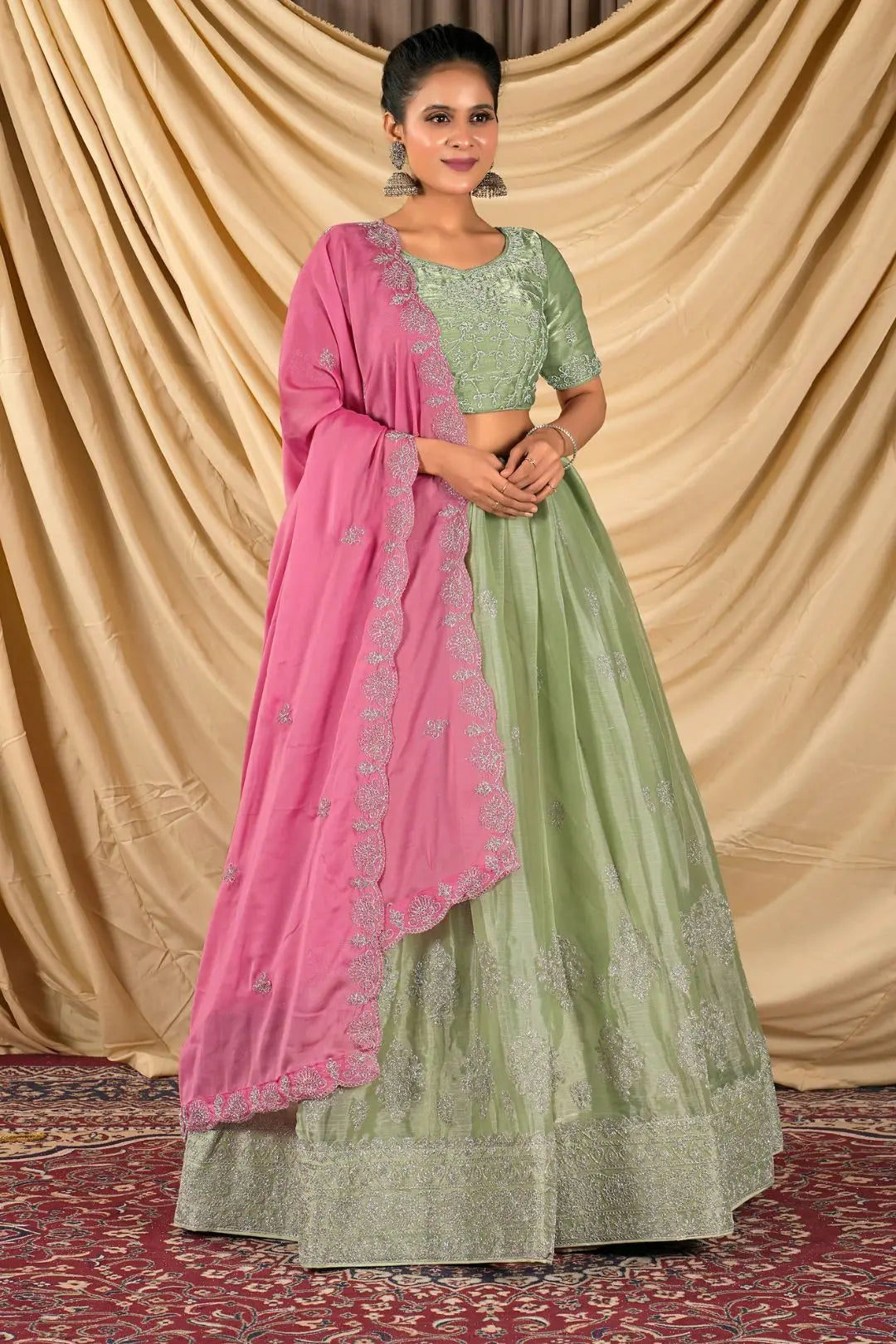 Woman wearing a green and pink traditional outfit