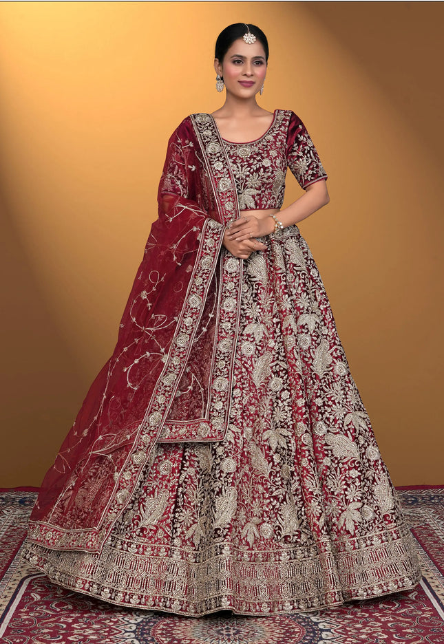 Woman wearing a traditional maroon and white embroidered outfit