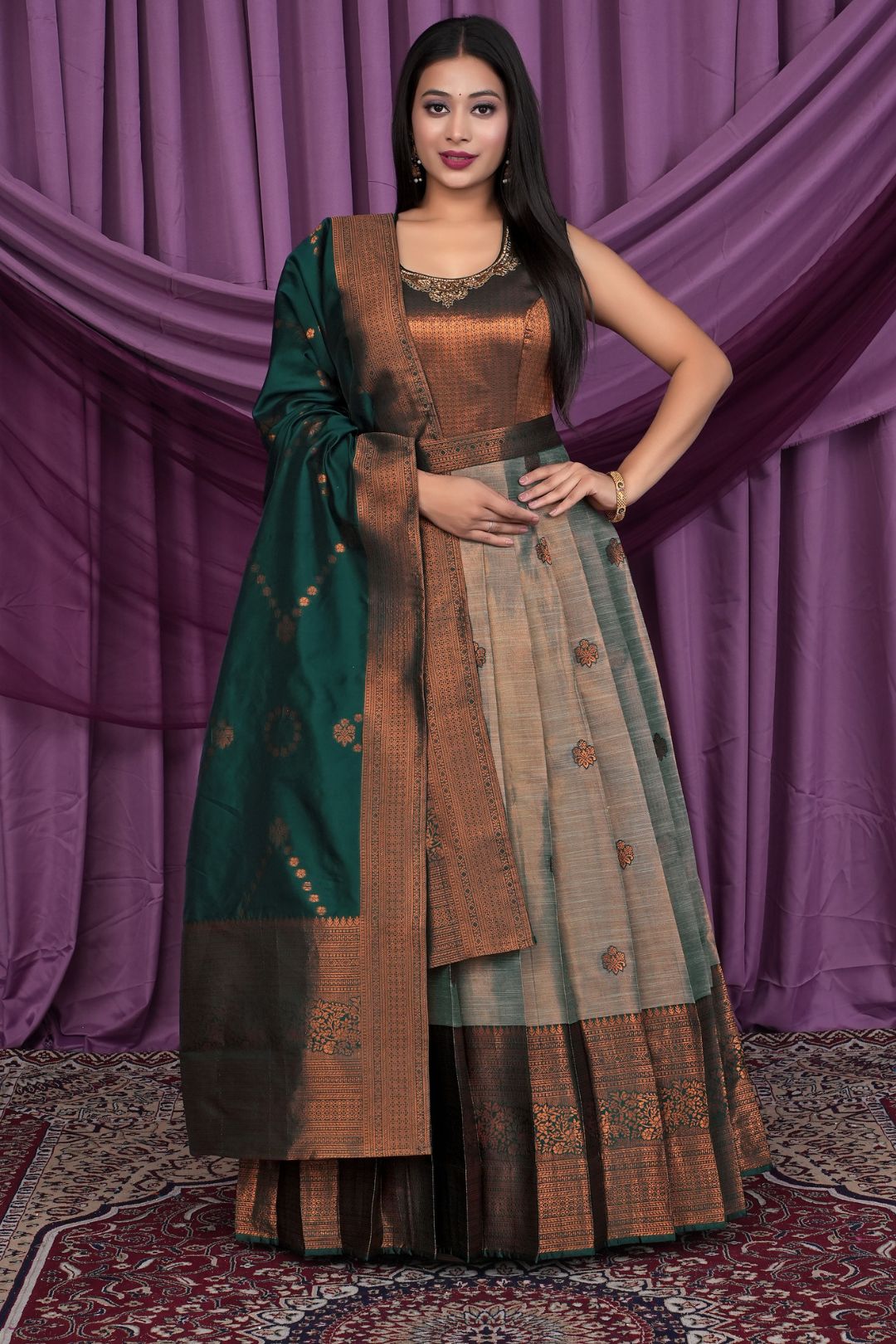 Woman wearing a traditional outfit with a green dupatta
