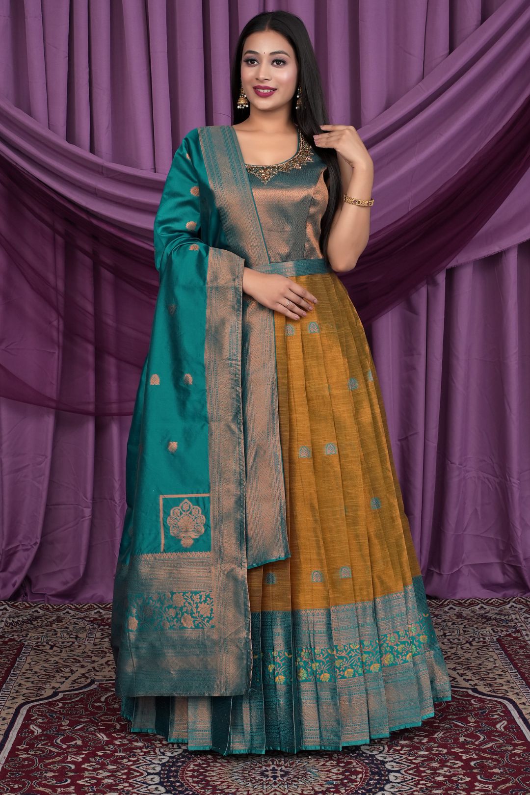 Woman wearing a traditional outfit with a teal and yellow Gown With Dupatta