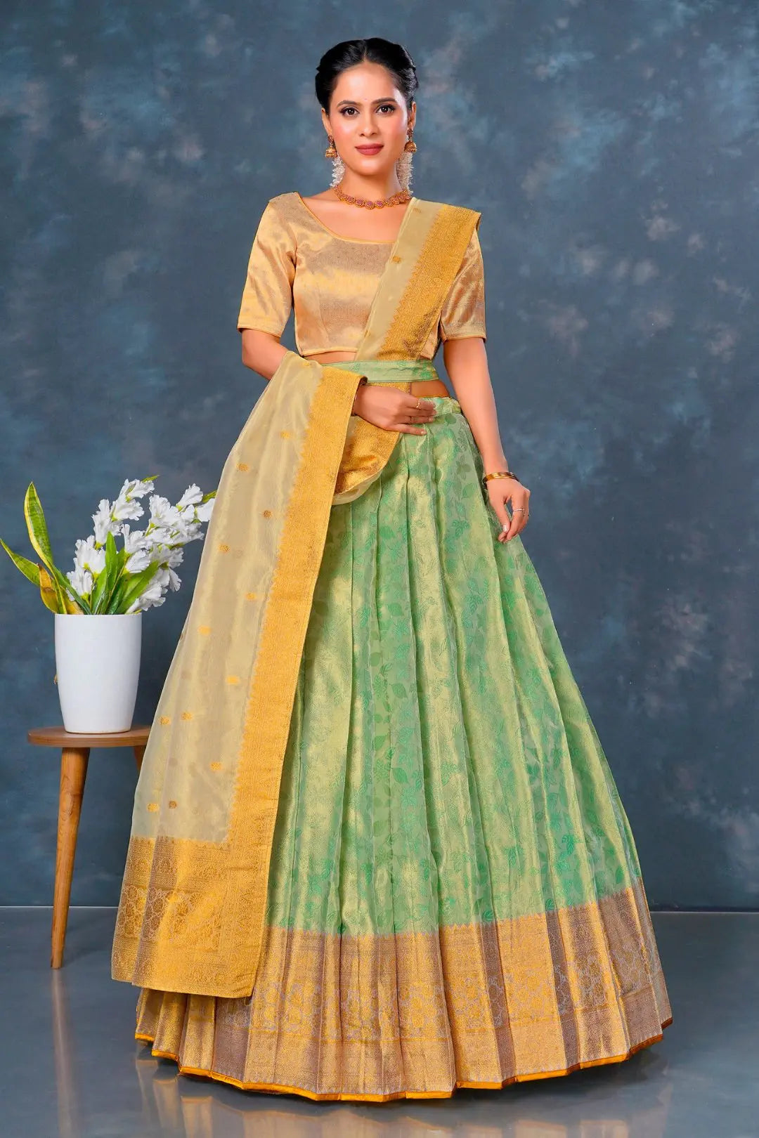 Woman wearing a traditional green and yellow outfit