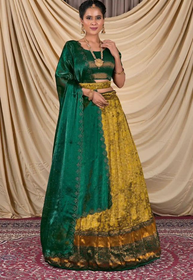 Woman wearing a green and yellow traditional lehenga choli with dupatta