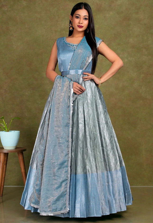 Woman wearing a blue and gray dress lehenga choli with dupatta