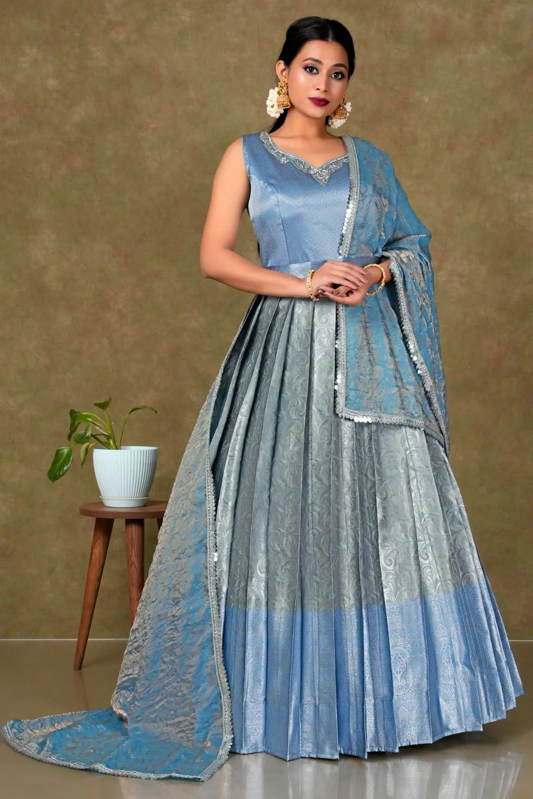 Woman in a blue and gray traditional gown with dupatta