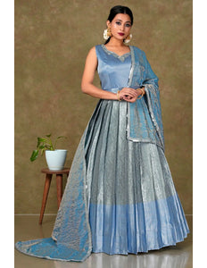 Woman in a blue and gray traditional gown with dupatta