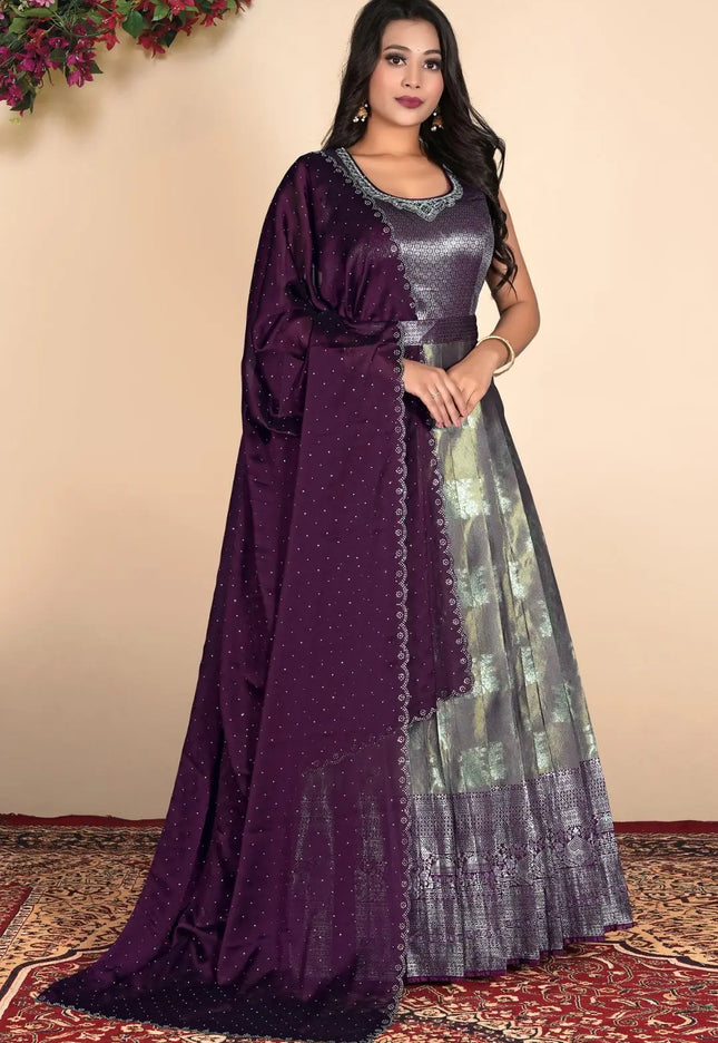 Woman wearing a purple and silver traditional outfit