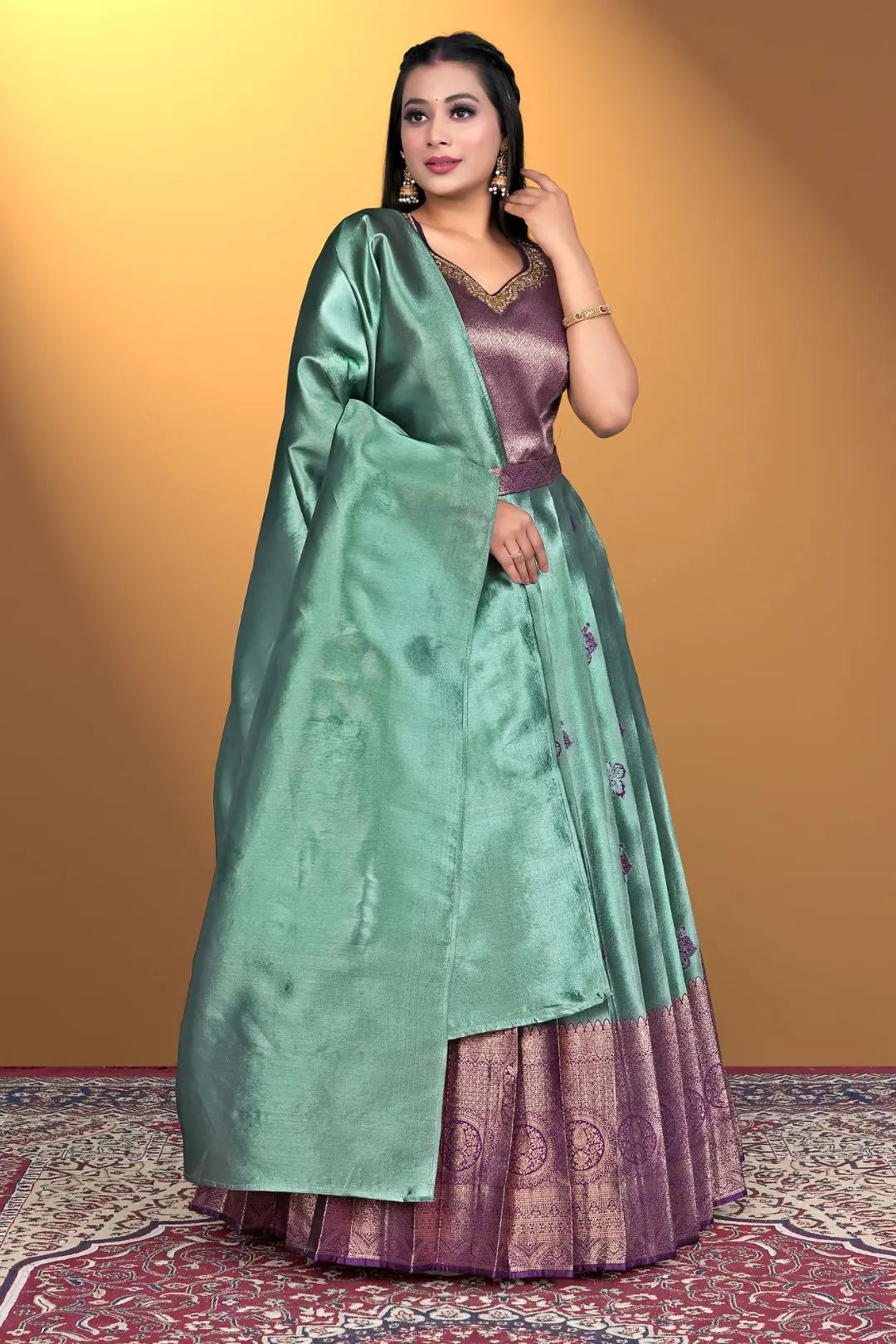 Woman wearing a green and purple traditional outfit