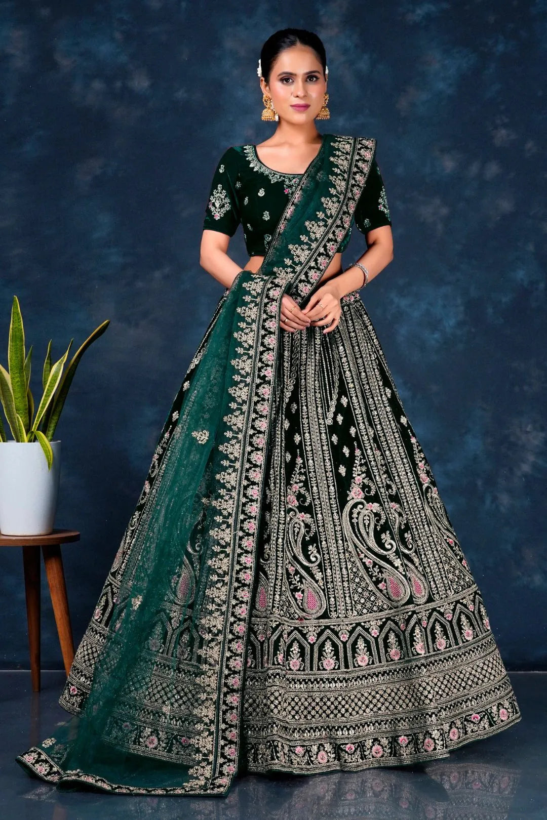 Green Heavy Embroidered Bridal Lehenga in Velvet
