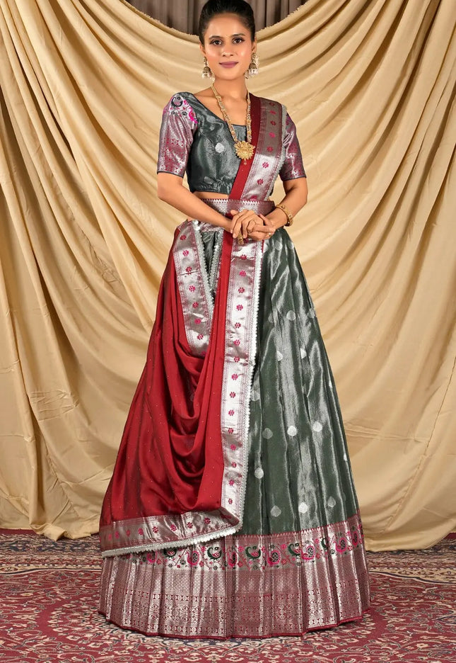 Woman wearing a traditional lehenga choli with a red and green pattern
