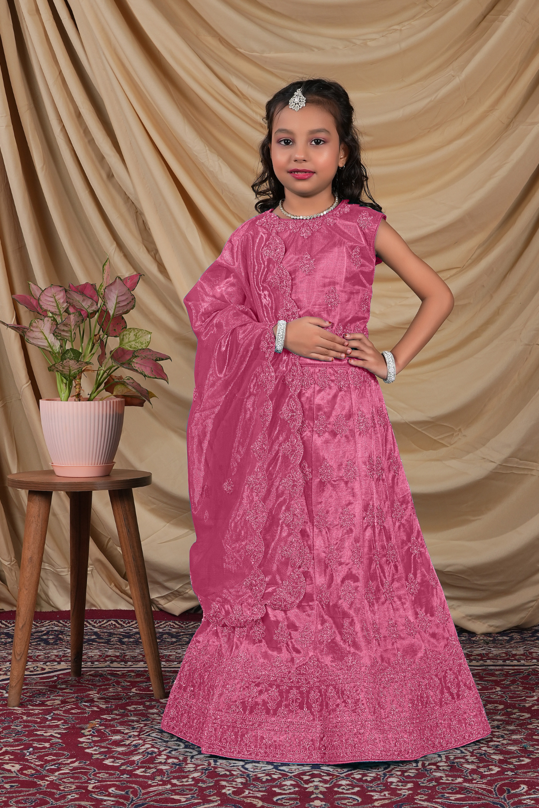 Young girl in a Rani Colour Kids Readymade Lehenga for Girls.
