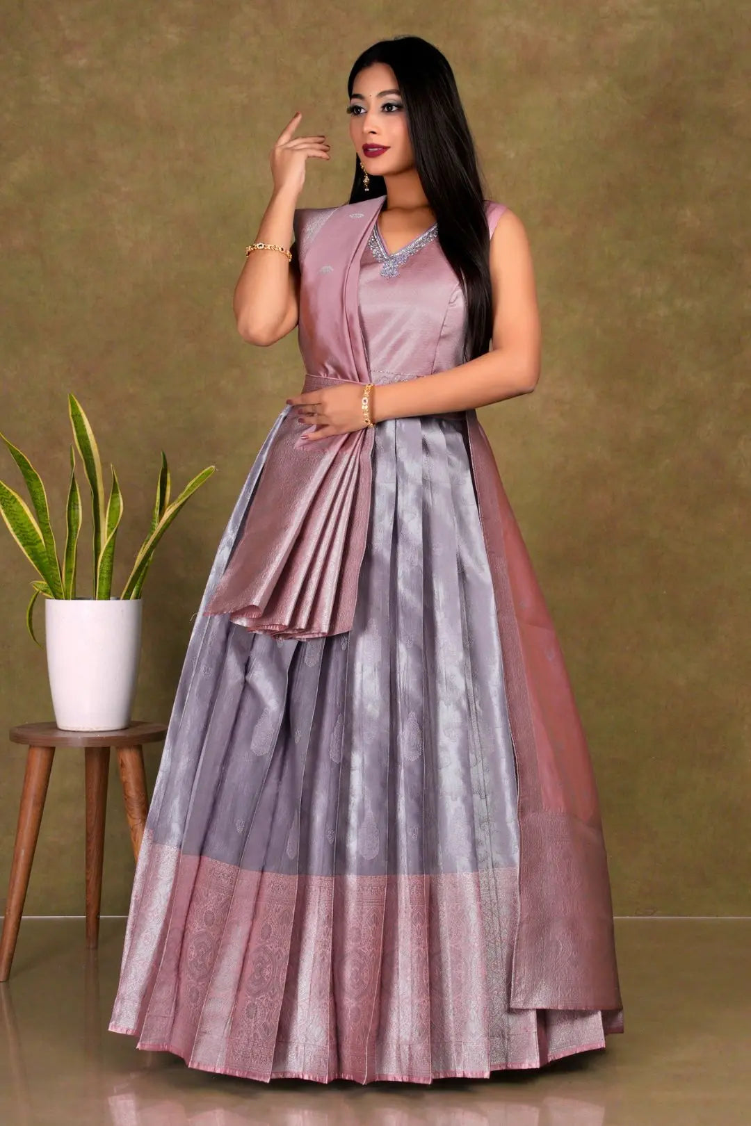 Woman wearing a two-tone long frock gown with dupatta