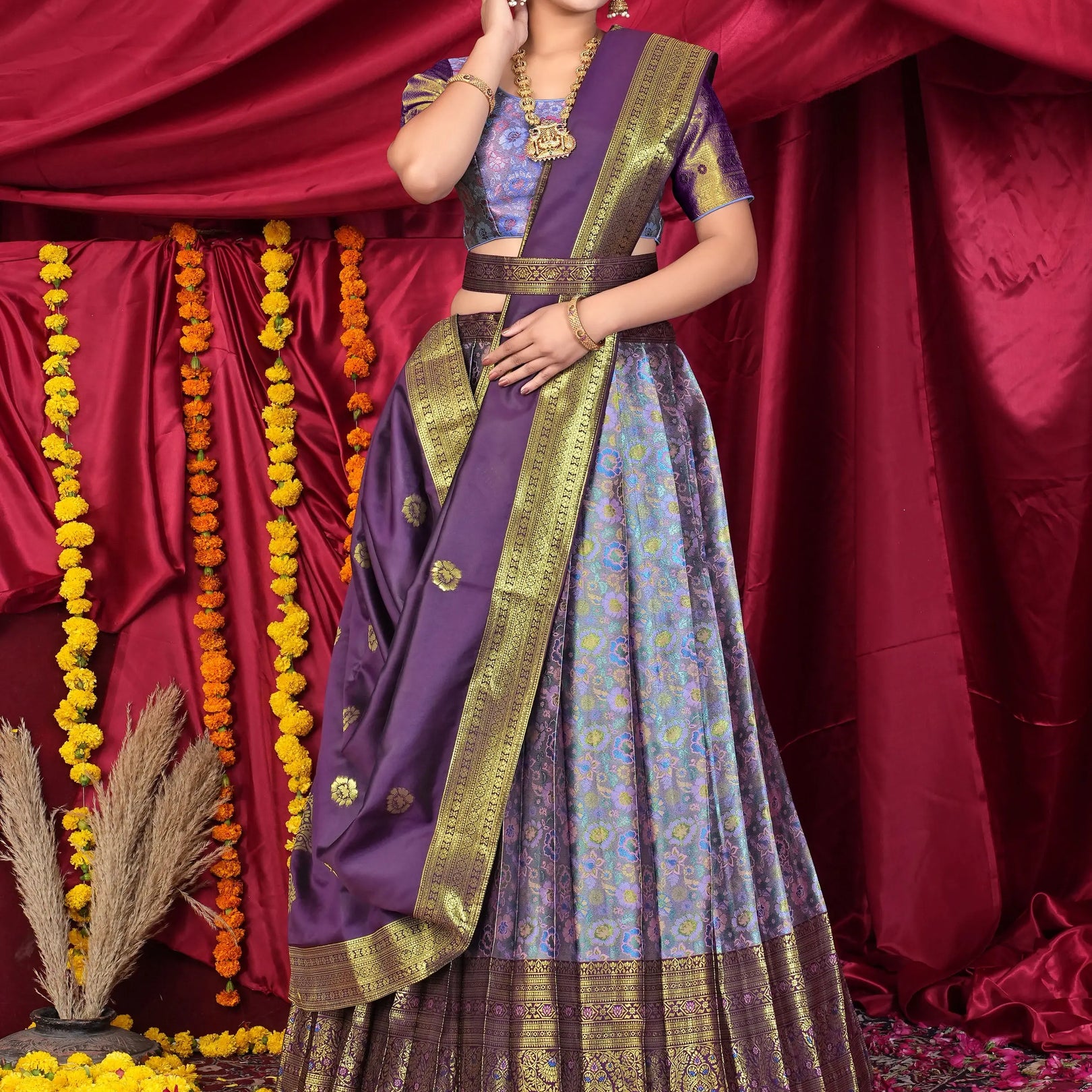 Woman in traditional purple and lavender lehenga choli