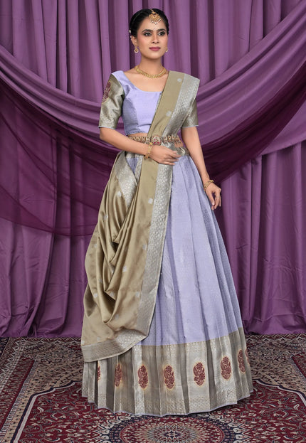 Woman in a traditional lavender color lehenga choli with chiku dupatta