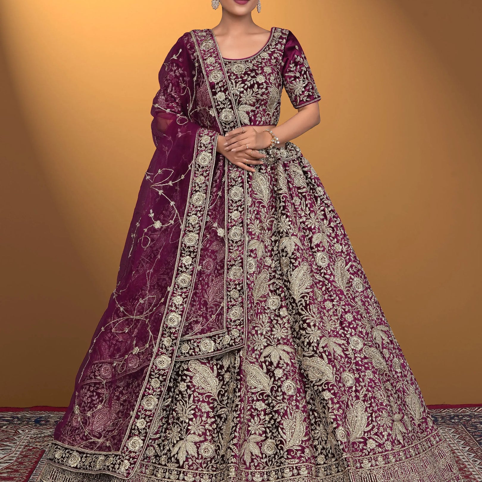 Woman wearing a traditional embroidered purple lehenga choli