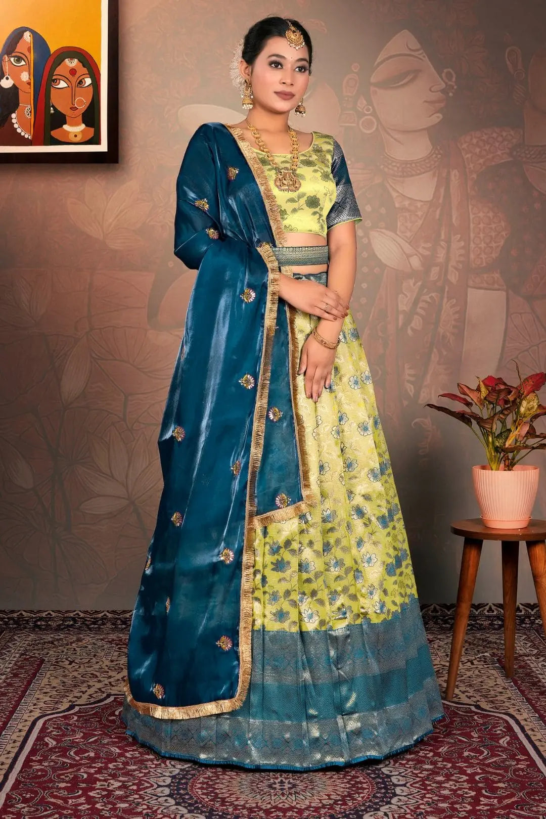 Woman in a traditional blue and liril lehenga choli with dupatta