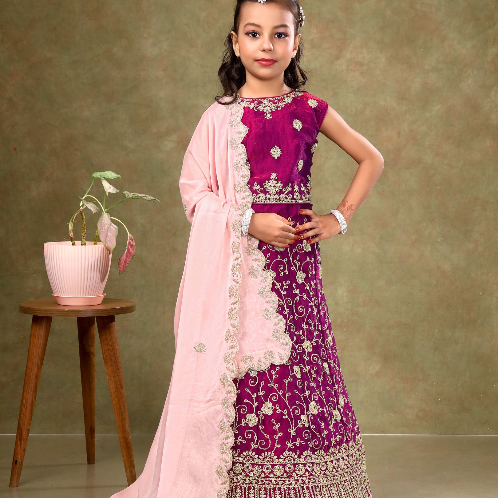 Young girl in a traditional outfit Kids Readymade Lehenga For Girls