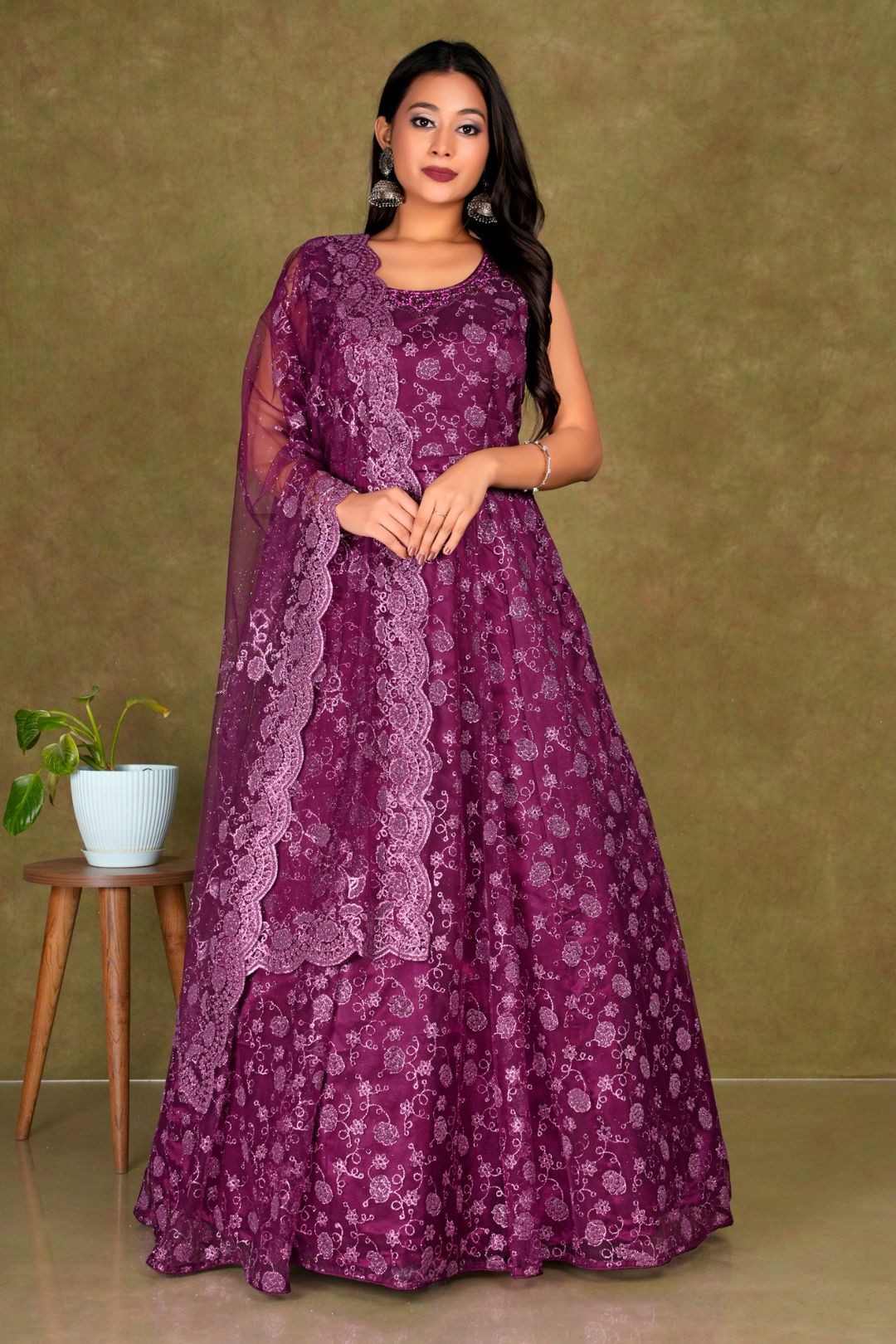 Woman wearing a Maroon dress with a matching dupatta Net Gown For Women