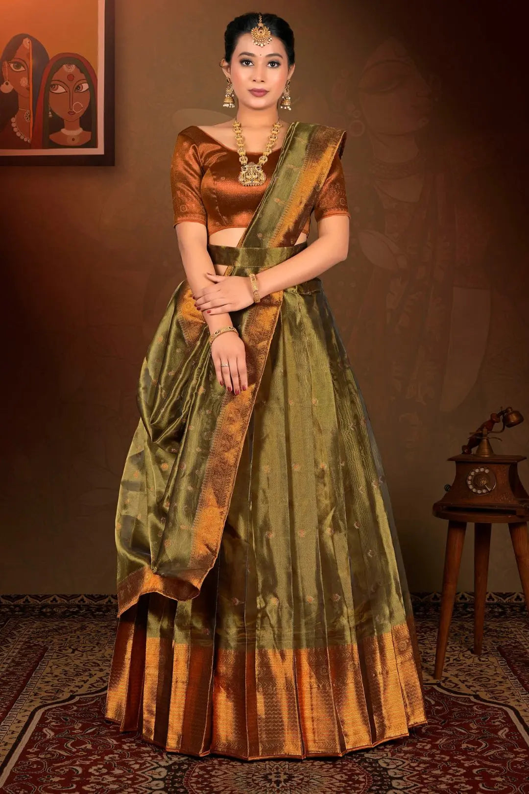 Woman in traditional green and brown lehenga choli with dupatta