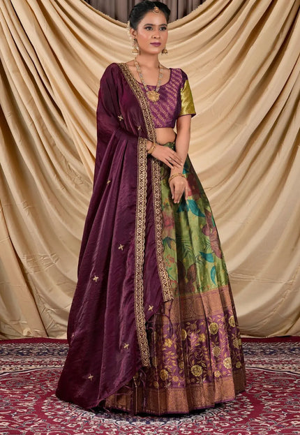 Woman wearing a traditional outfit with a purple dupatta and colorful skirt