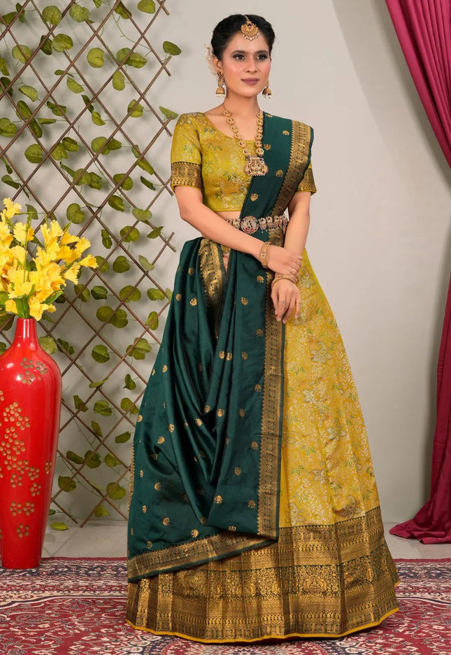 Woman wearing a green and yellow lehenga choli with dupatta