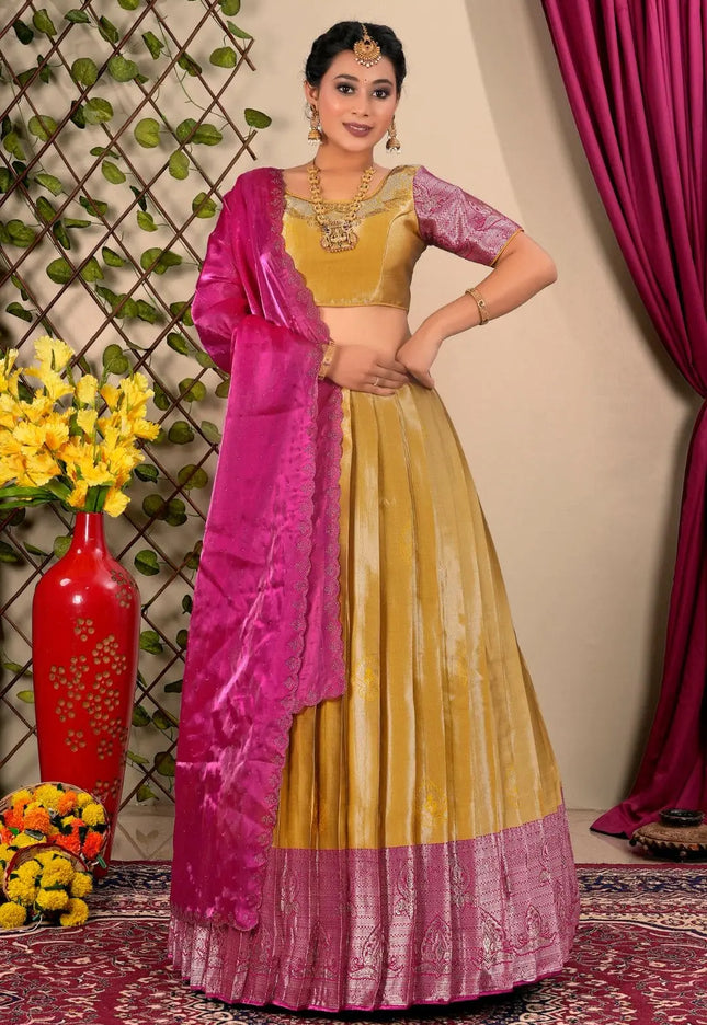 Woman in a yellow and pink traditional lehenga choli with dupatta