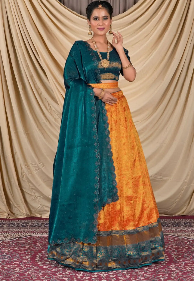 Woman wearing a traditional teal and orange lehenga choli and dupatta