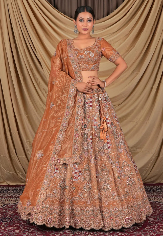 Rust Party Wear Embroidered Twill Net Lehenga Choli For Women