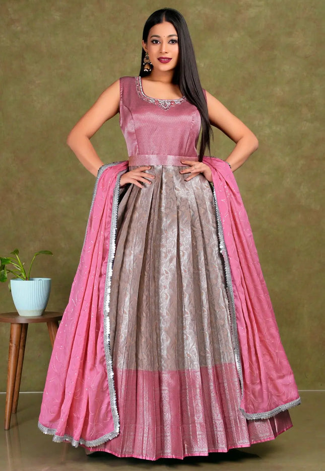 Woman wearing a pink and gray traditional gown with dupatta