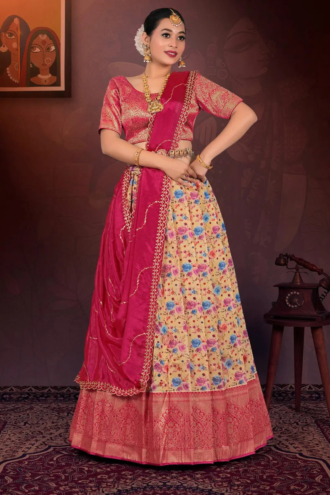 Woman in traditional pink and floral lehenga choli with dupatta