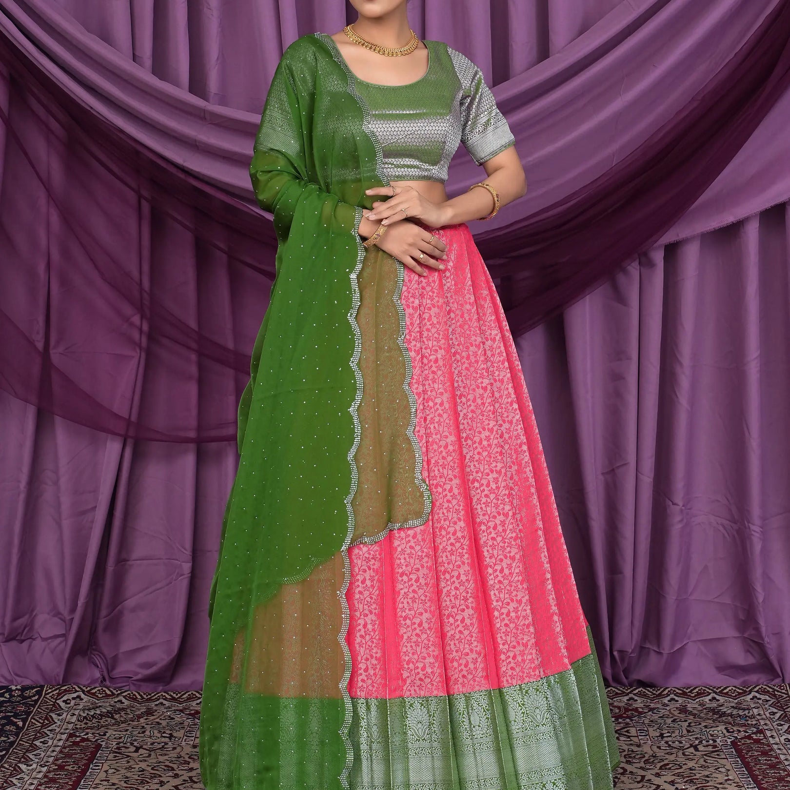 Woman wearing a green and pink traditional outfit