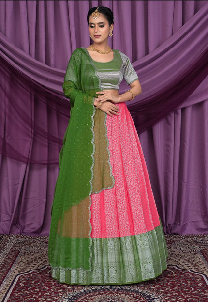 Woman wearing a green and pink traditional outfit