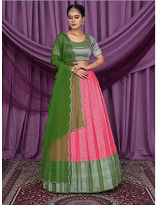 Woman wearing a green and pink traditional outfit