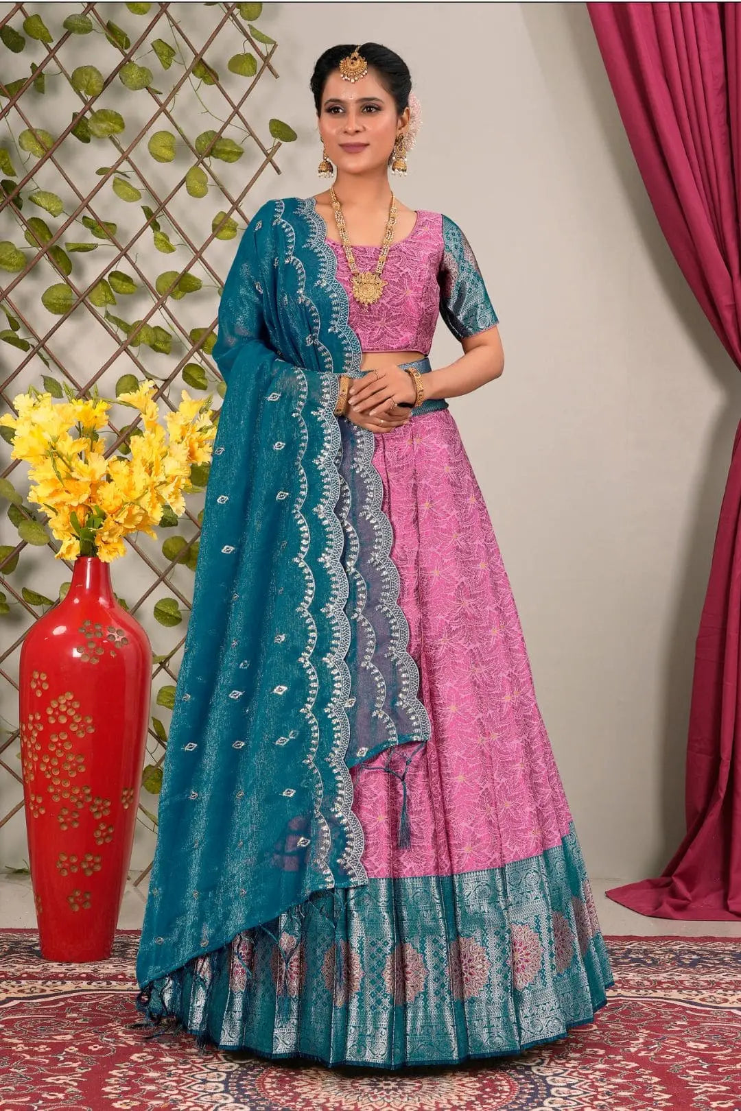 Woman in a pink and blue traditional lehenga choli with dupatta