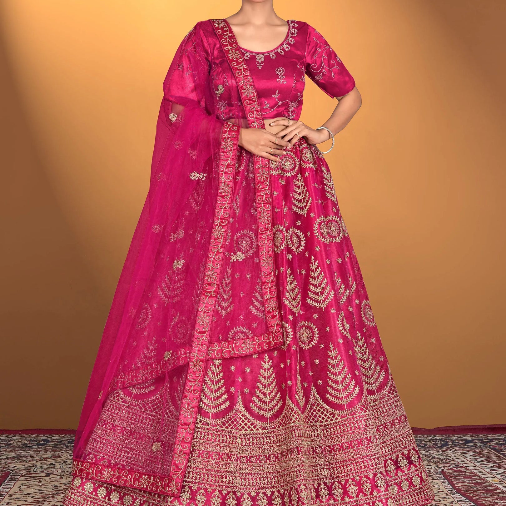 Woman wearing a traditional pink embroidered outfit