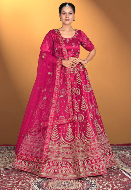 Woman wearing a traditional pink embroidered outfit