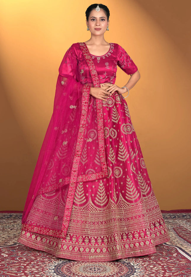 Woman wearing a traditional pink embroidered outfit
