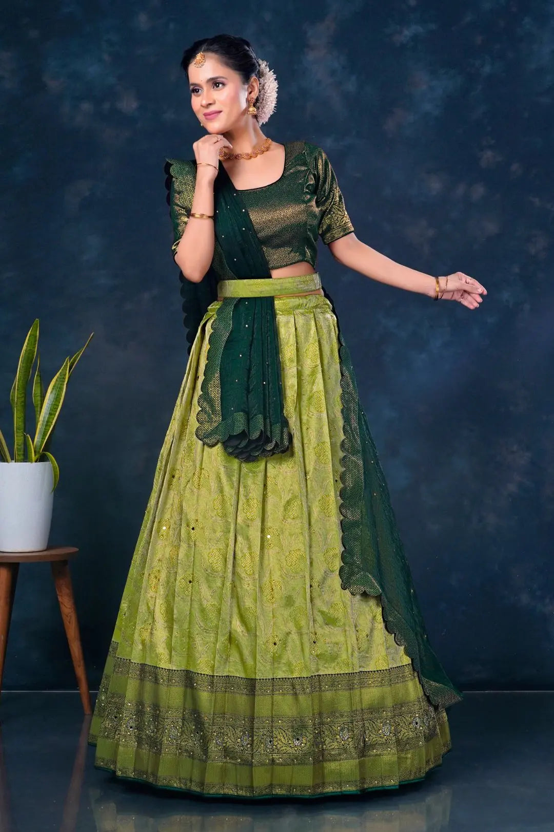 Woman in a green traditional lehenga choli with dupatta