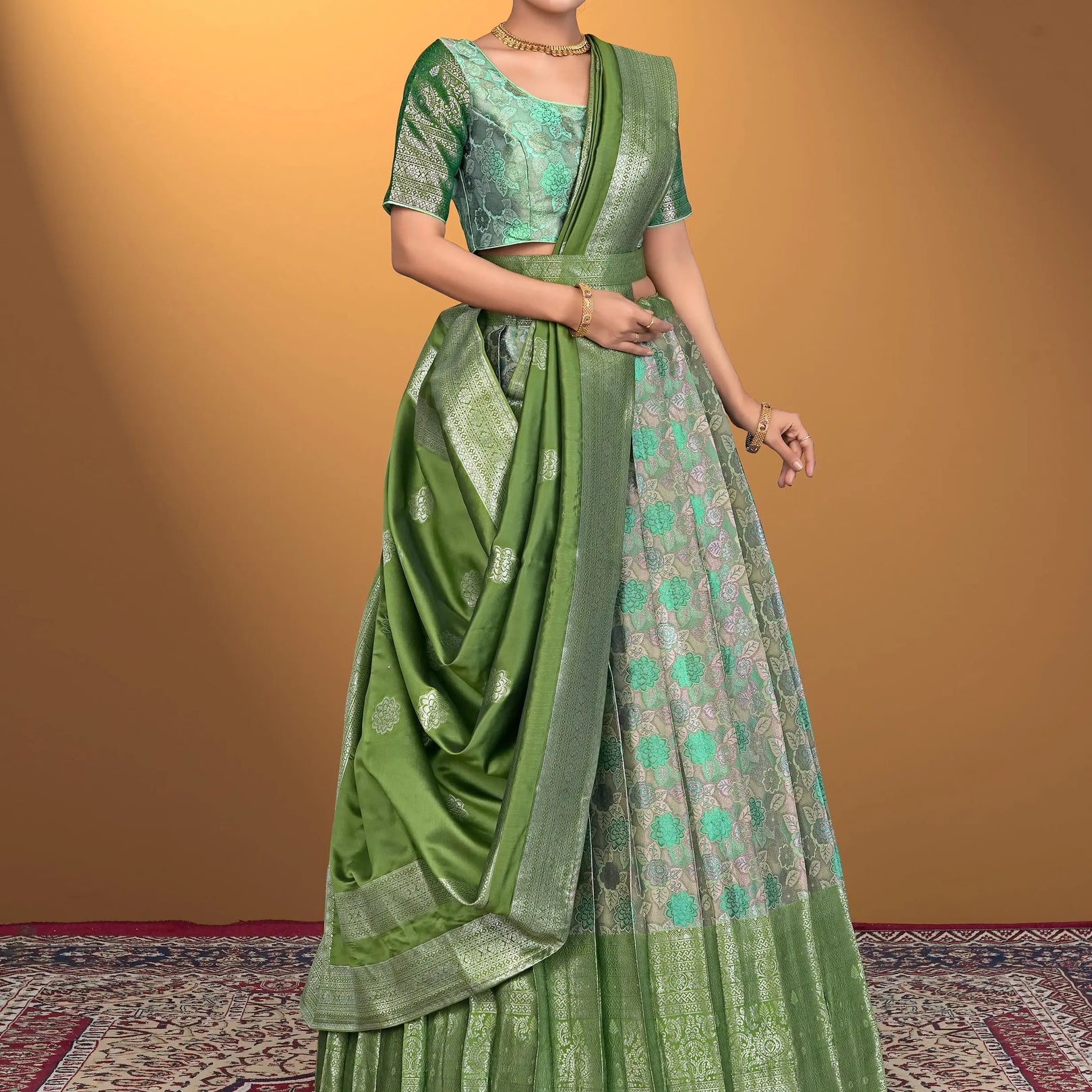Woman wearing a green lehenga with a matching blouse