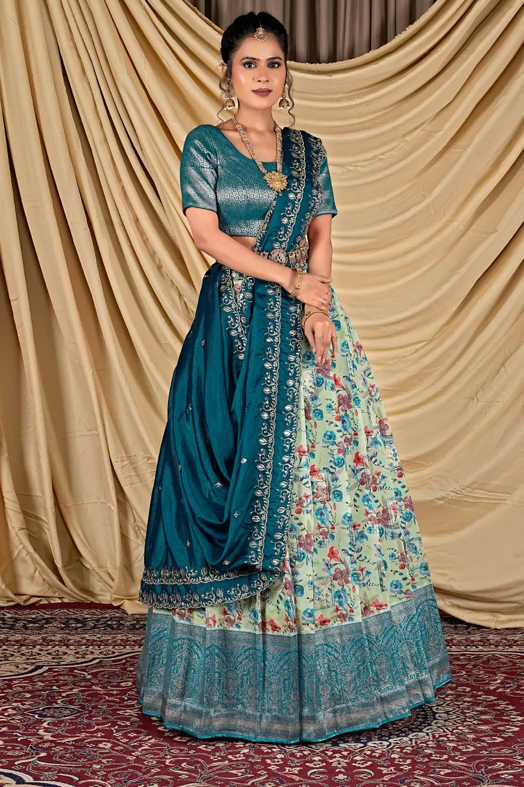 Woman wearing a traditional pista and floral lehenga choli with dupatta