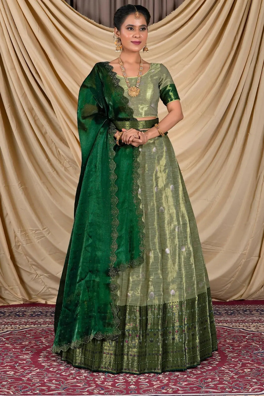 Woman wearing a green lehenga with a matching blouse