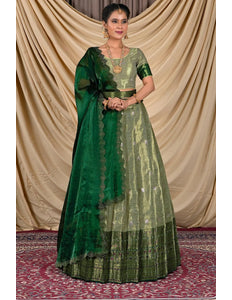 Woman wearing a green lehenga with a matching blouse