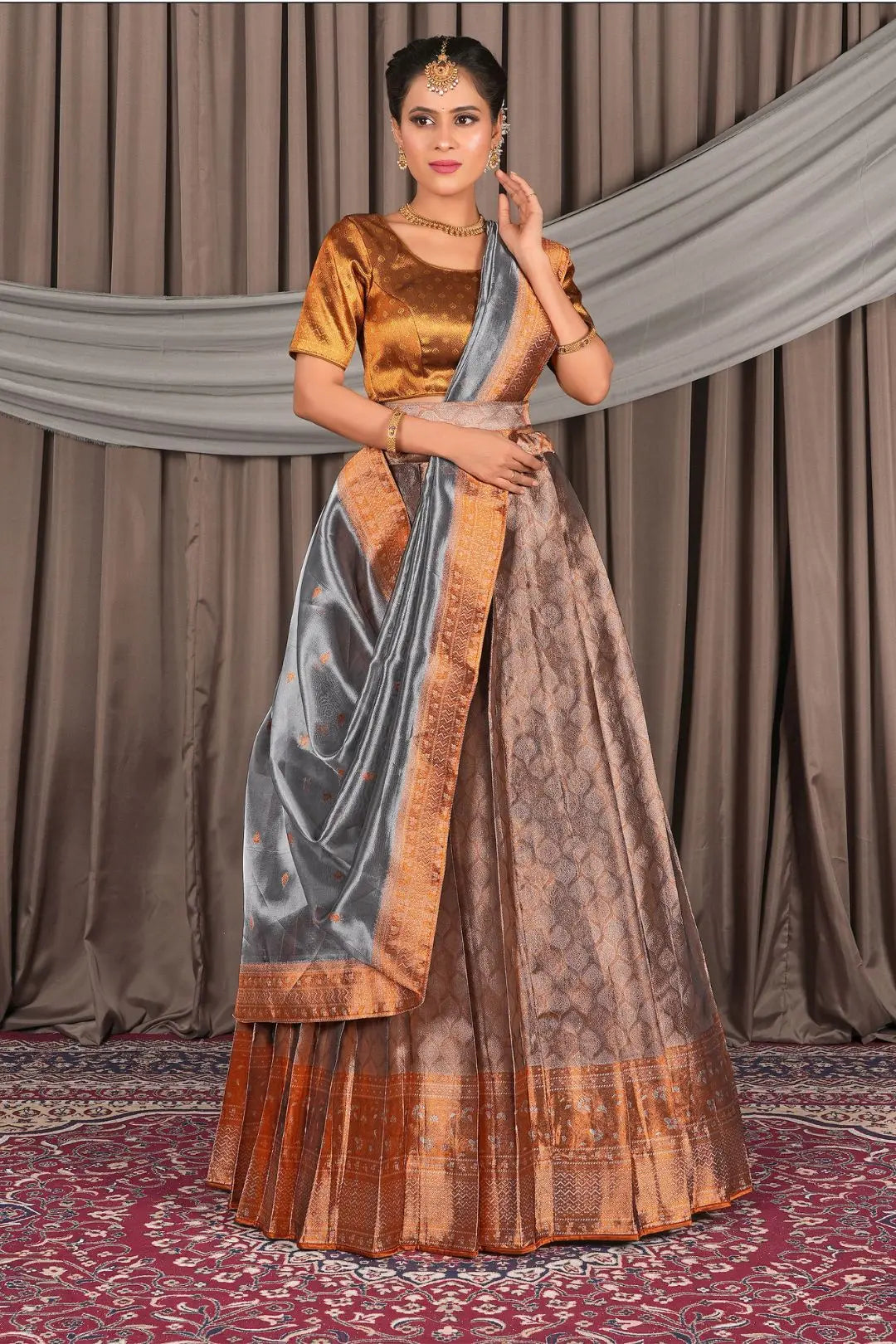 Woman wearing a traditional peach lehenga choli with dupatta