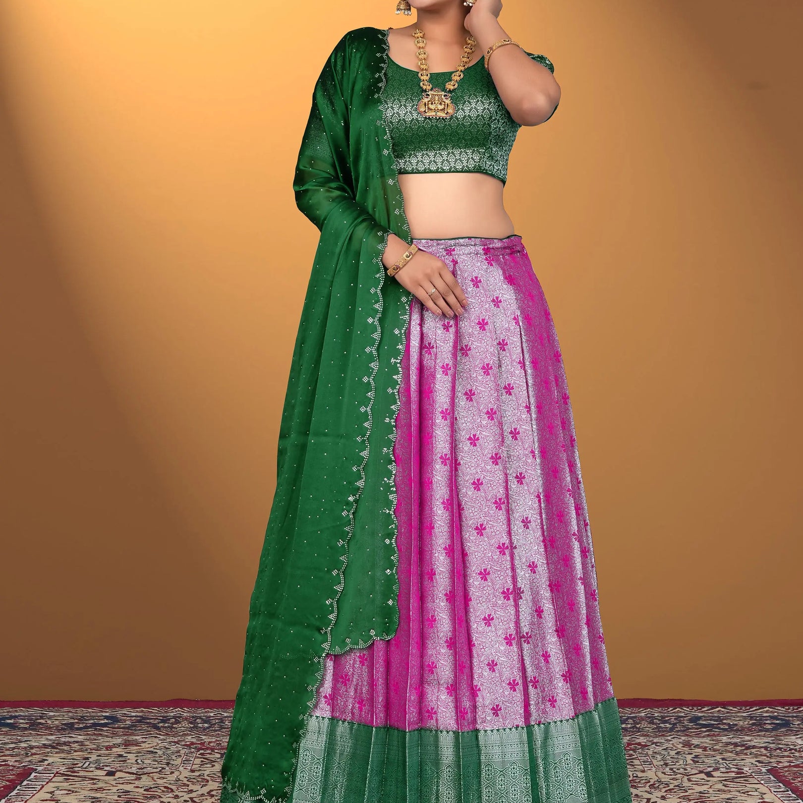 Woman wearing a green and pink traditional outfit