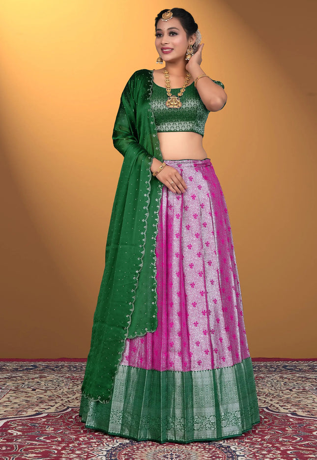 Woman wearing a green and pink traditional outfit