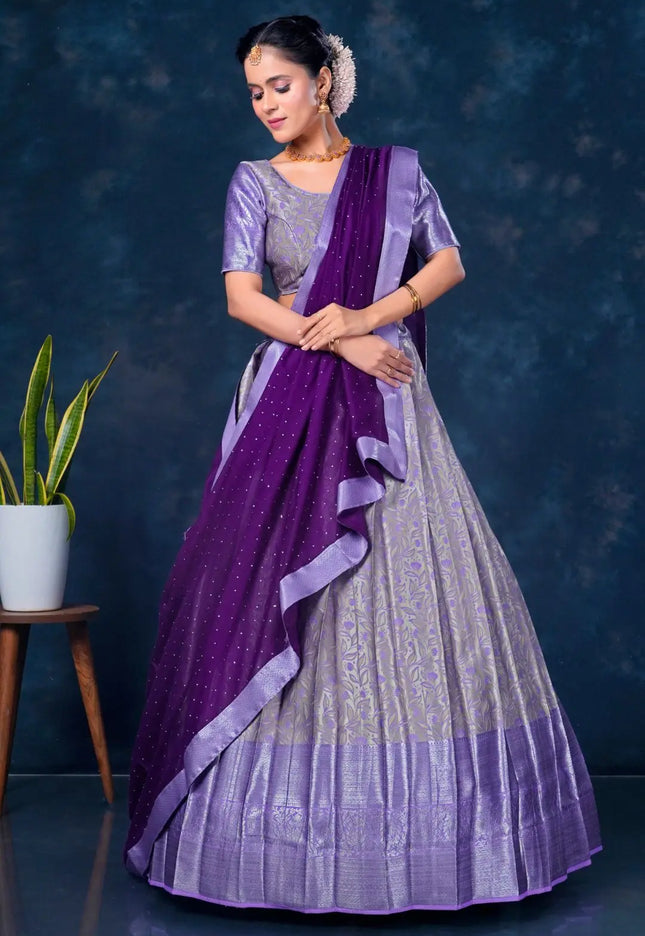 Woman wearing a purple lehenga choli with dupatta