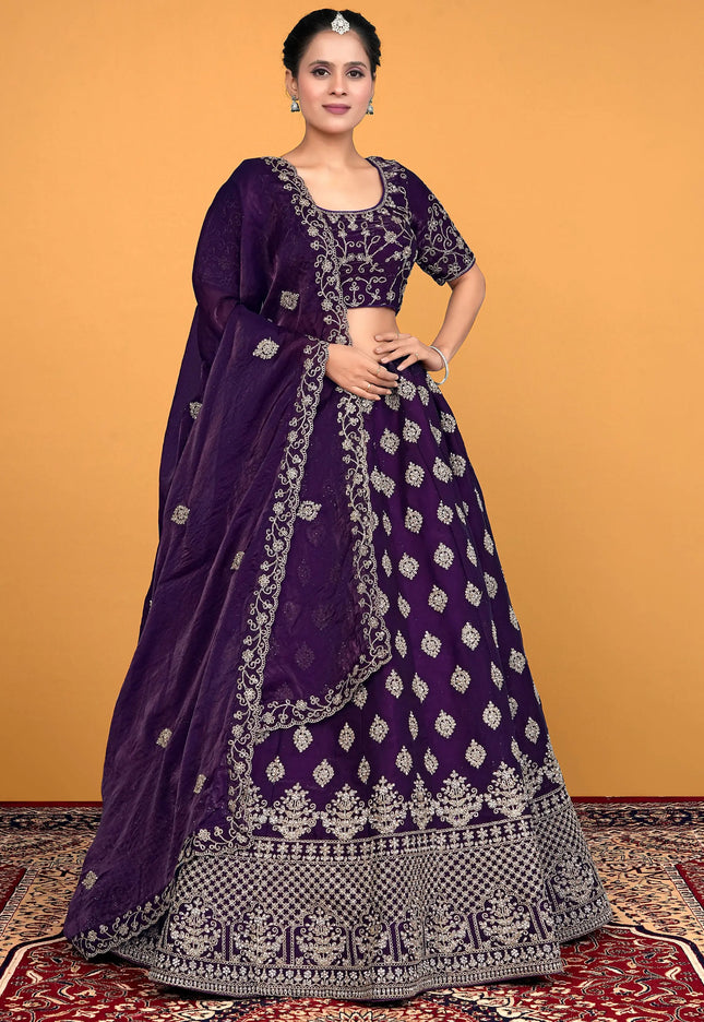 Woman wearing a purple embroidered lehenga choli