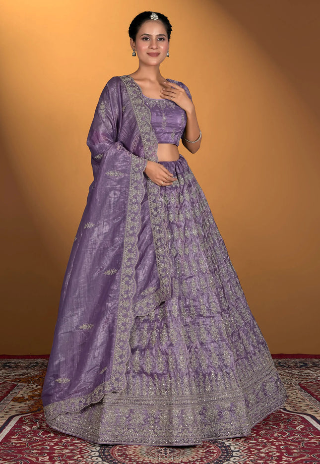 Woman wearing a traditional purple lehenga