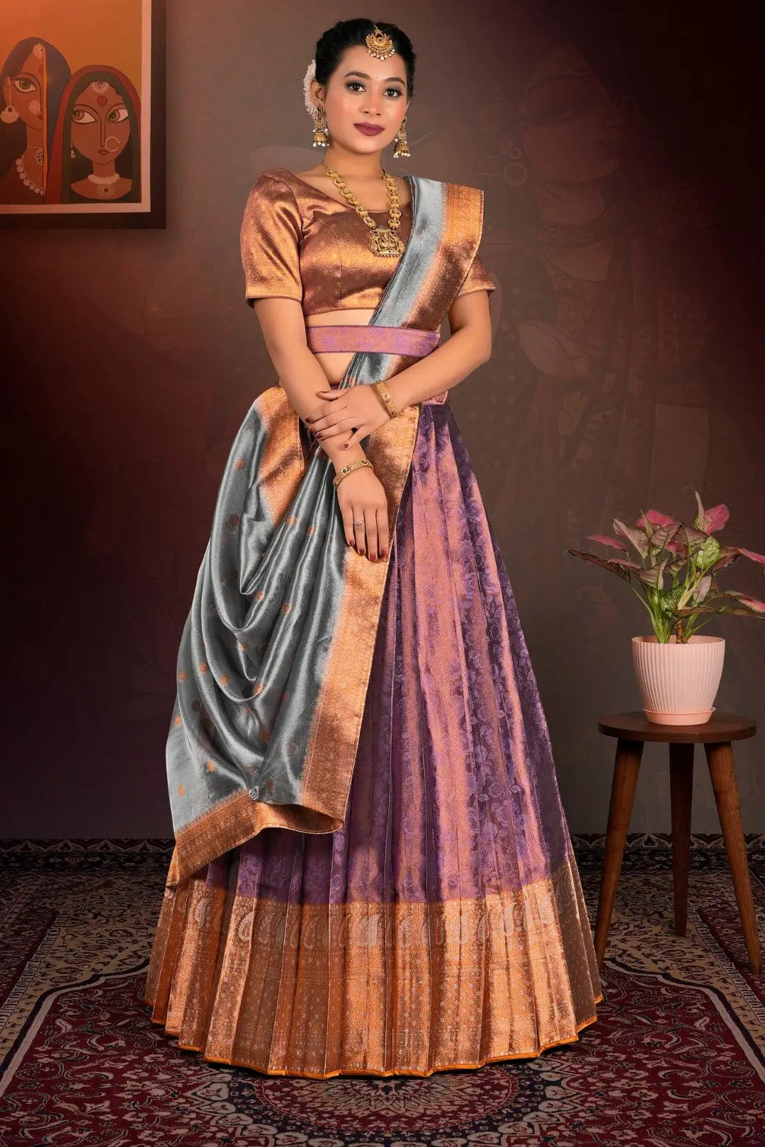 Woman in traditional purple lehenga choli with dupatta