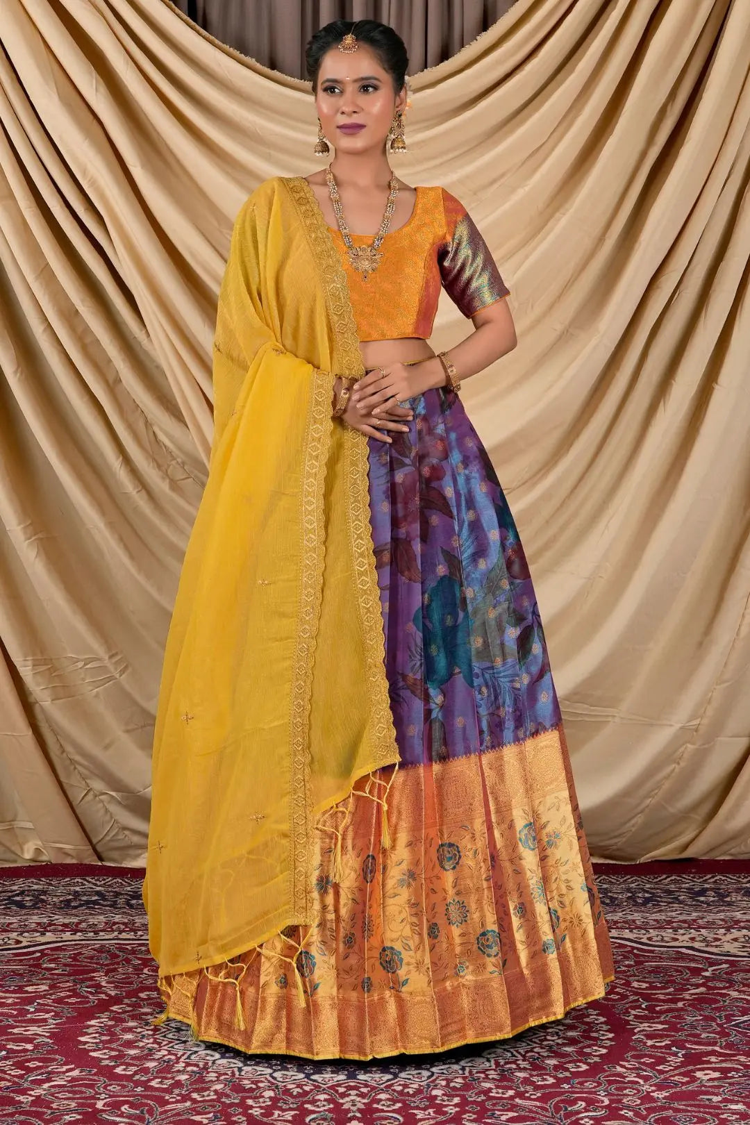 Woman wearing a traditional outfit with a yellow blouse and colorful skirt